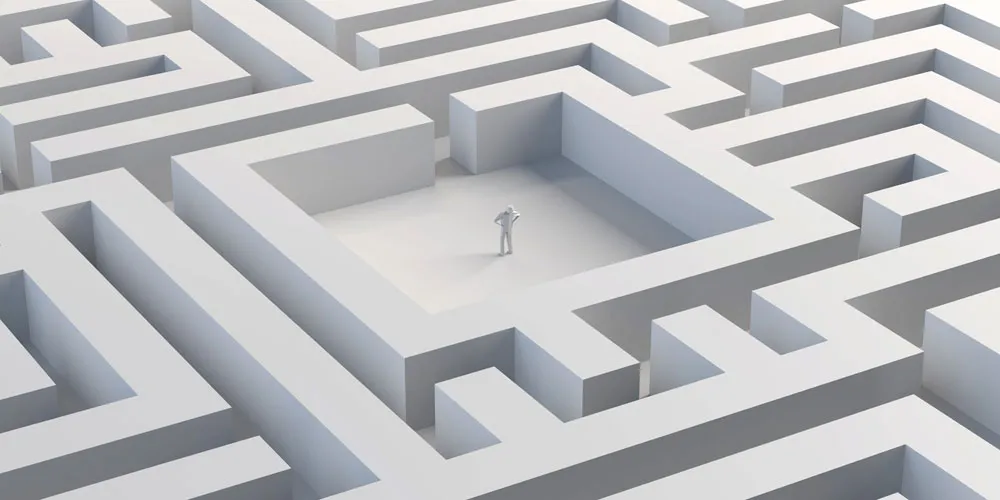 mazePerson standing in the middle of a maze Person standing in the middle of a maze